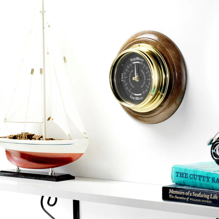Tabic Handmade Prestige Tide Clock in Solid Brass With a Jet Black Dial, mounted on a solid English Dark Oak Wall Mount